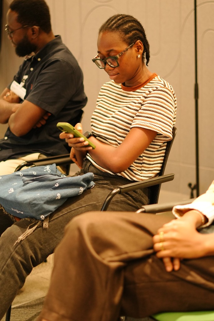 Audience members taking notes