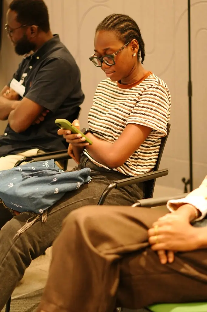 Audience members taking notes